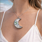 Crescent-shaped necklace with sea crystals.