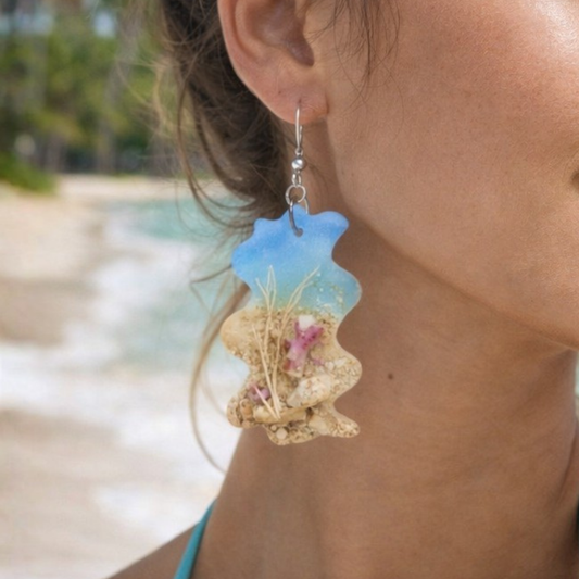 Earrings made with beach sand.