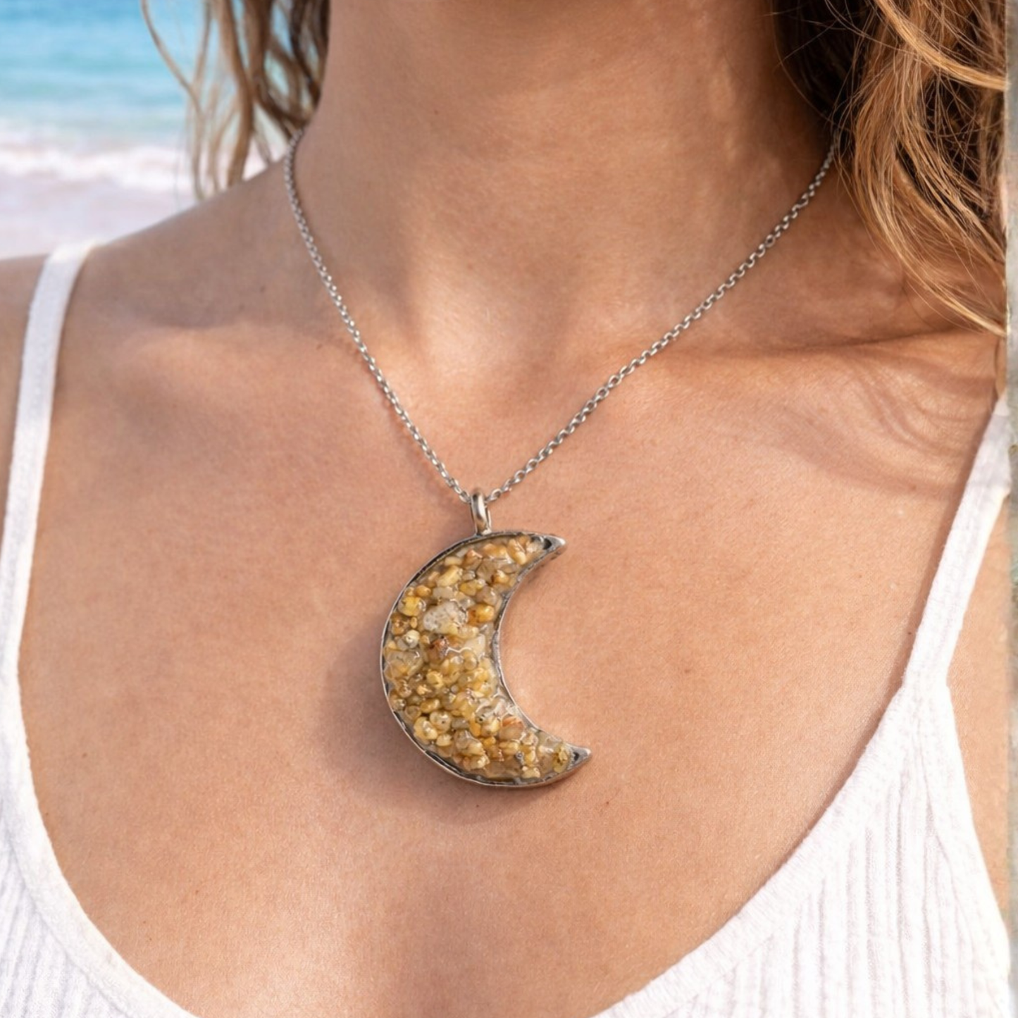 Crescent-shaped necklace, made with sea sand